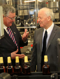 Mr Ewing at the BenRiach bottling line and in conversation with Mr Walker