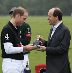 The Duke of Cambridge is givin a bottle of Royal Salute