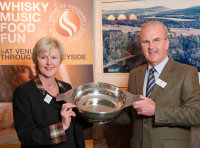 Jim Royan, Festival Chairman presenting Ann Miller with the Spirit of Speyside Whisky Festival Quaich at the Festival's Annual General Meeting, Knockando Distillery on 2nd October 2009.