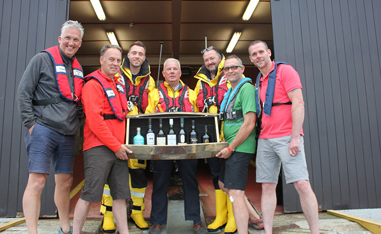 Group of seven malt whiskies from each of Islay's coastal distilleries Goes Under The Hammer for RNLI